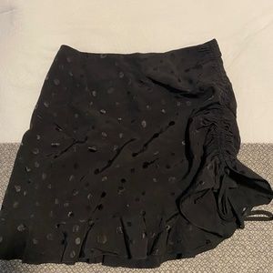 Black polka dot mini skirt